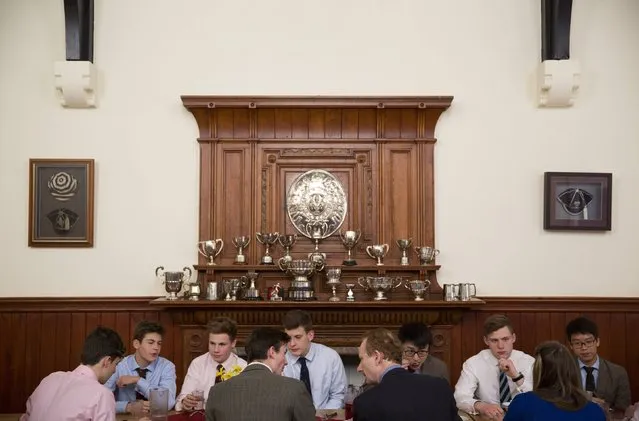 Pupils eat a meal in a dining room in a boarding house at Rugby School in central England, March 18, 2015. (Photo by Neil Hall/Reuters)