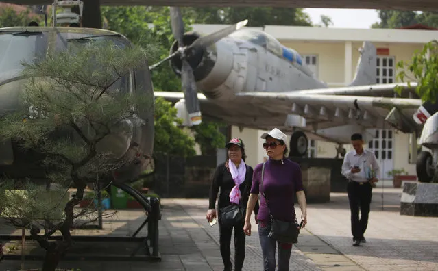 In this February 21, 2019, photo, visitors walk next to American aircraft at the Vietnam Military History Museum in Hanoi, Vietnam. The Vietnamese capital once trembled as waves of American bombers unleashed their payloads, but when Kim Jong Un arrives here for his summit with President Donald Trump he won’t find rancor toward a former enemy. Instead, the North Korean leader will get a glimpse at the potential rewards of reconciliation. (Photo by Hau Dinh/AP Photo)