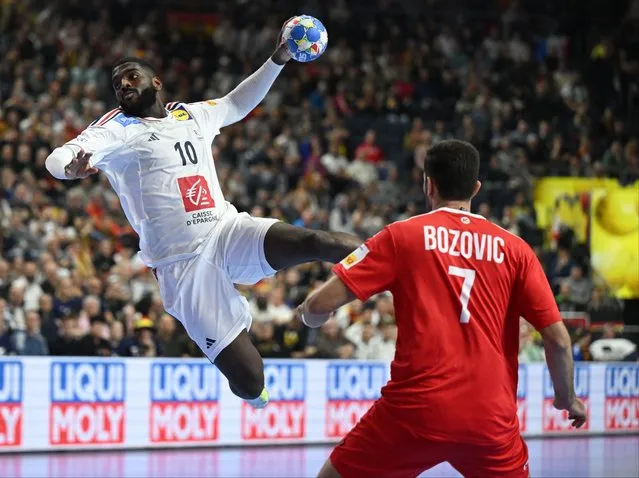 France's right back #10 Dika Mem attempts to score during the Men's EURO 2024 EHF Handball European Championship main round match between France and Austria in Cologne, western Germany on January 22, 2024. (Photo by Ina Fassbender/AFP Photo)
