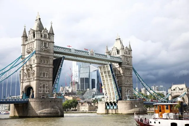 Tower Bridge is seen stuck in the open position, due to a technical fault, in London, Britain, August 9, 2021. (Photo by Henry Nicholls/Reuters)