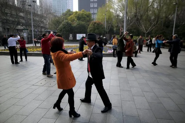 People dance at a park in Shanghai, China, March 14, 2016. (Photo by Aly Song/Reuters)