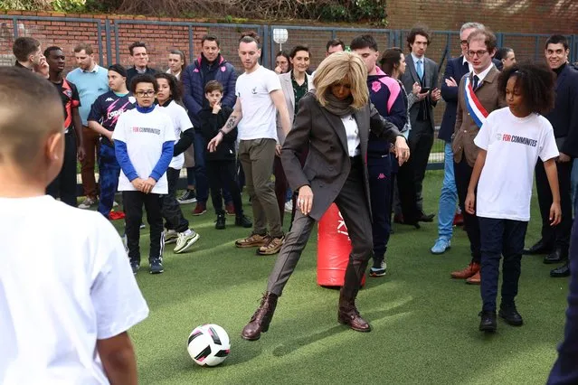 French president's wife Brigitte Macron (C) takes part in a football activity with youths during a visit the medical-educational institute (IME) Leonce Malecot as part of the Oympic and Paralympic Week, in Saint-Cloud, west of Paris, on April 3, 2024. The Paris 2024 Oympic and Paralympic Games are held  from July 26 to August 11, 2024. (Photo by Emmanuel Dunand/AFP Photo)