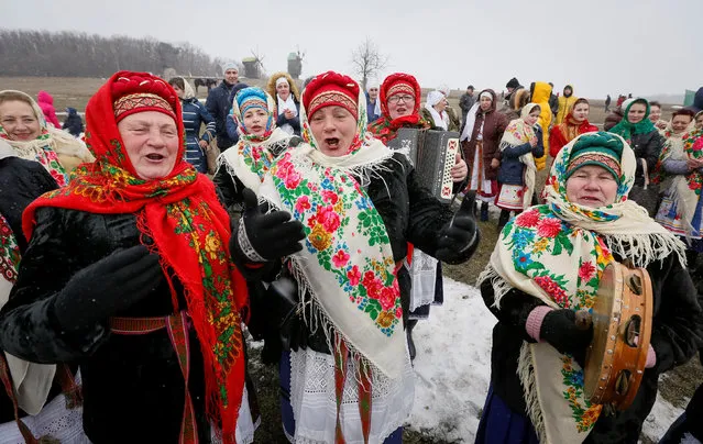 Revellers sing during the celebration of Maslenitsa also known as Kolodiy, a pagan holiday marking the end of winter, in Kiev, Ukraine, February 26, 2017. (Photo by Vasily Fedosenko/Reuters)