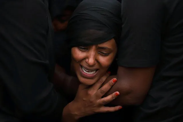A relative mourns during the funeral ceremony of Ethiopian Army Chief of Staff, Seare Mekonnen who was killed by his bodyguard, in Mekele,Tigray Region, Ethiopia on June 26, 2019. (Photo by Tiksa Negeri/Reuters)