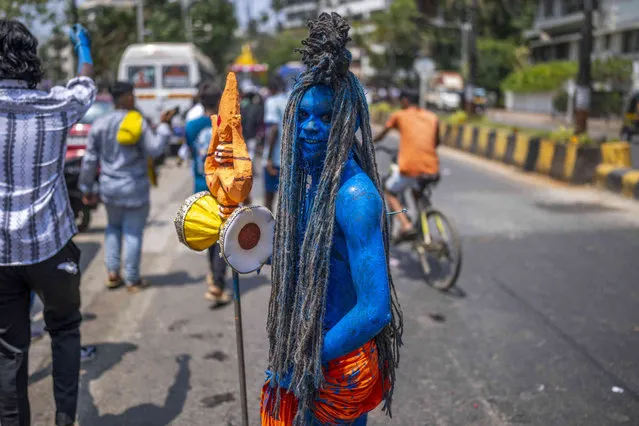 A devotee dressed as Lord Shiva at a religious procession marking “Panguni Uthiram” festival in Mumbai, India, Tuesday, April 23, 2024. (Photo by Rafiq Maqbool/AP Photo)