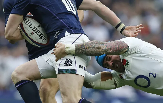 England's Jack Nowell, right, tackles Scotland's Finn Russell during the Six Nations rugby union international between England and Scotland at Twickenham stadium in London, Saturday March 11, 2017. (Photo by Alastair Grant/AP Photo)