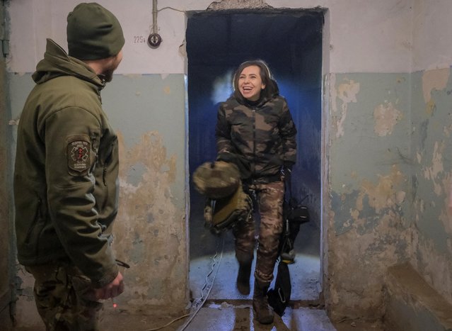 A medic reacts as she arrives in a frontline medical stabilisation point, amid Russia's attack on Ukraine, in Donetsk region, Ukraine on February 28, 2023. (Photo by Alex Babenko/Reuters)