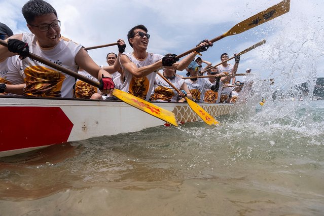 Competitors take part in the annual dragon boat race to celebrate the Tuen Ng festival in Hong Kong, Monday, June 10, 2024. (Photo by Chan Long Hei/AP Photo)