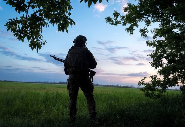 A Ukrainian serviceman of the 92nd separate assault brigade guards an area, amid Russia's attack on Ukraine, near the town of Vovchansk in Kharkiv region, Ukraine, on May 19 2024. (Photo by Inna Varenytsia/Reuters)