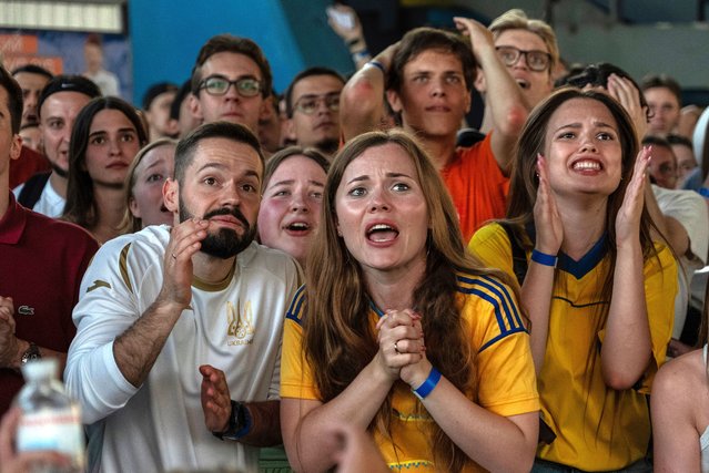 Ukraine fans react during a public screening of the Euro 2024 soccer match between Ukraine and Belgium in Kyiv, Ukraine, on Wednesday, June 26, 2024. (Photo by Alex Babenko/AP Photo)