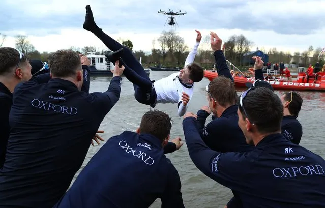 Coxswain, Jack Tottem of Oxford University Boat Club is thrown into the river following victory in during The Gemini Boat Race on April 03, 2022 in London, England.  (Photo by Warren Little/Getty Images)