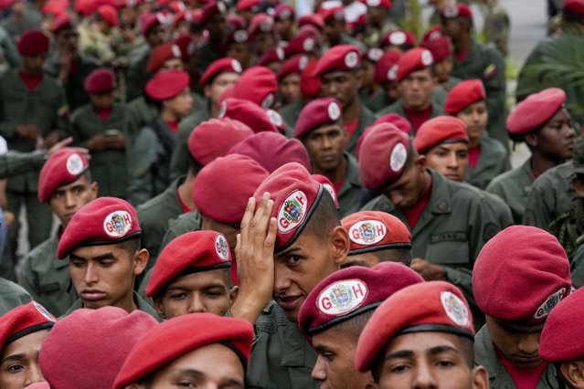 Members of the presidential guar line up to vote during presidential elections in Caracas, Venezuela, Sunday, July 28, 2024. (Photo by Matias Delacroix/AP Photo)