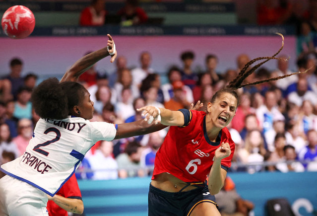 Carmen Campos of Spain in action with Meline Nocandy of France during Spain vs France handball in  women's preliminary round Group B on August 3, 2024. (Photo by Eloisa Lopez/Reuters)