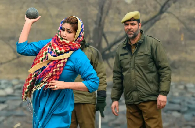 Kashmiri woman takes part in a physical test of a recruitment rally for the Special Police Officers (SPO) in Jammu and Kashmir Police, in Srinagar on December 6, 2019. As many as 23,000 people have applied for posts in the Special Police Officers (SPO) in Jammu and Kashmir Police and 100 positions will filled in the current phase of recruitment, local authorities said. (Photo by Tauseef Mustafa/AFP Photo)