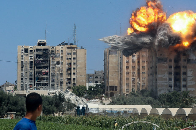 An explosion occurs following an Israeli air strike on a residential building, amid the Israel-Hamas conflict, in Nuseirat in the central Gaza Strip, on July 20, 2024. (Photo by Omar Naaman/Reuters)