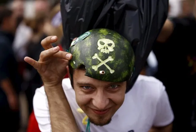 A man shows his watermelon hat during the 21st Woodstock Festival in Kostrzyn-upon-Odra, Poland July 31, 2015. (Photo by Kacper Pempel/Reuters)