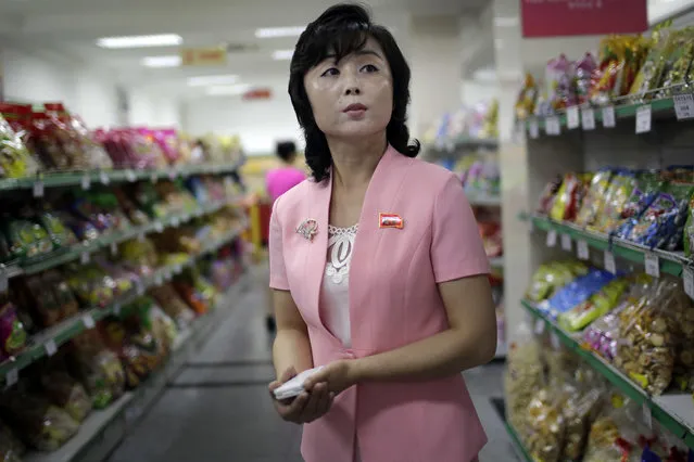 In this Monday, June 19, 2017, photo, Song Un Pyol, manager at the Potonggang department store stands in the snacks aisle while being interviewed by The Associated Press in Pyongyang, North Korea. (Photo by Wong Maye-E/AP Photo)