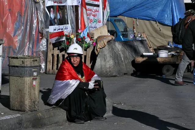 A woman takes part in the ongoing anti-government protests in Tahrir Square, Baghdad, Iraq, Saturday, February 1, 2020. (Photo by Khalid Mohammed/AP Photo)