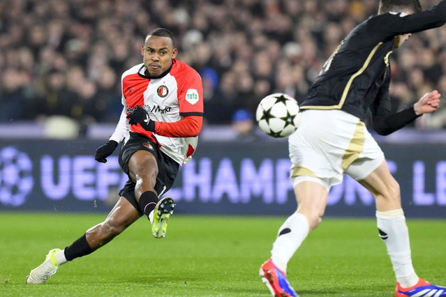 Feyenoord's Brazilian forward #14 Igor Paixao (L) shoots to score his team's second goal during the UEFA Champions League, league phase football match between Feyenoord and Sparta Praha at the Stadion Feijenoord 'De Kuip' in Rotterdam, on December 11, 2024. (Photo by John Thys/AFP Photo)
