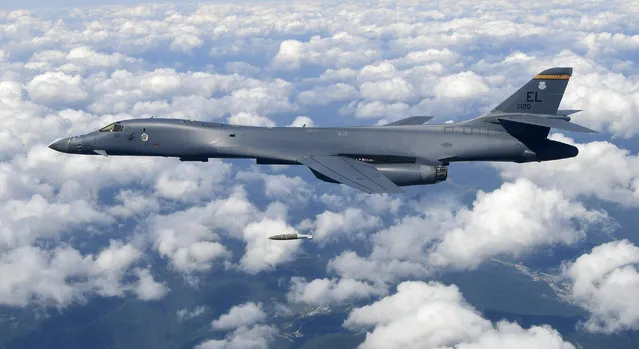 In this photo provided by South Korea Defense Ministry on Monday, September 18, 2017, U.S. Air Force B-1B bomber drops a bomb as it flies over the Korean Peninsula during a joint drills, South Korea. South Korea says the U.S. military has flown powerful bombers and stealth jets over the Korean Peninsula in joint drills with South Korean warplanes. (Photo by South Korea Defense Ministry via AP Photo)