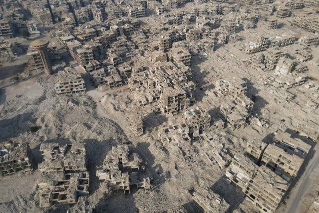 An aerial photo shows the destroyed buildings at the Yarmouk camp for Palestinian refugees in southern Damascus on December 10, 2024. The fall of president Bashar al-Assad has put Syria at a crossroads, after nearly 14 years of civil war sparked by his deadly crackdown on democracy protests. (Photo by Mohammed Al-Rifai/AFP Photo)