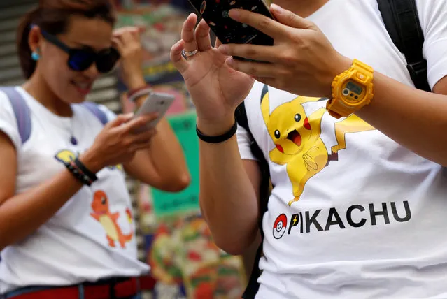Participants take part in the world's first “Pokemon Go” competition in Hong Kong, China, August 6, 2016. (Photo by Tyrone Siu/Reuters)