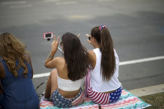 Revelers take selfies during the Made in America music festival in Philadelphia, Pennsylvania September 5, 2015. (Photo by Mark Makela/Reuters)