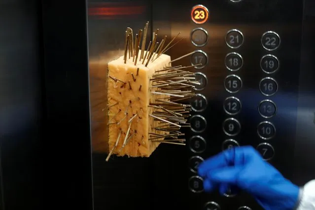 A sponge with toothpicks is seen inside an elevator to prevent people from touching the buttons with their bare hands at a residential society in Mumbai, India, August 2, 2020. (Photo by Francis Mascarenhas/Reuters)