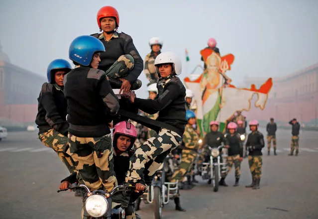 India's Border Security Force (BSF) “Daredevils” women motorcycle riders perform during a rehearsal for the Republic Day parade on a cold winter morning in New Delhi, India, January 10, 2018. (Photo by Adnan Abidi/Reuters)