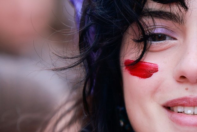 A demonstrator takes part in a rally in Rome, Italy, on March 8, 2024. (Photo by Yara Nardi/Reuters)