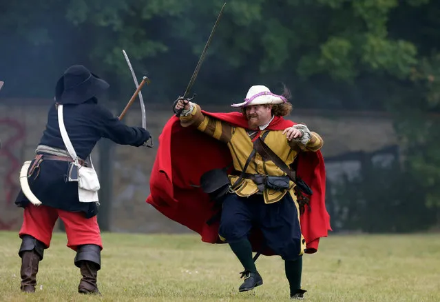 Participants wearing medieval costumes re-enact the 1620 battle of Bila Hora between Bohemian Estates and Austrian Imperial with Catholic forces in Prague, Czech Republic September 18, 2016. (Photo by David W. Cerny/Reuters)