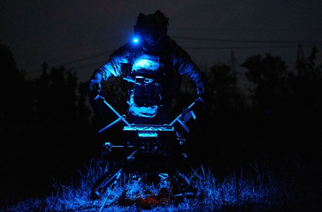 A service member of a drone unit of the 24th Separate Mechanized Brigade named after King Danylo of the Ukrainian Armed Forces prepares a heavy combat drone before its flight over positions of Russian troops, amid Russia's attack on Ukraine, in Donetsk Region, Ukraine on June 11, 2025. (Photo by Serhii Korovainyi/Reuters)