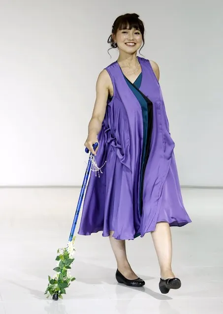 A model, a muscular dystrophy patient, walking with a cane, presents a creation by designer Takafumi Tsuruta from his Spring/Summer 2016 collection for his brand tenbo during Tokyo Fashion Week in Tokyo, Japan, October 13, 2015. (Photo by Yuya Shino/Reuters)