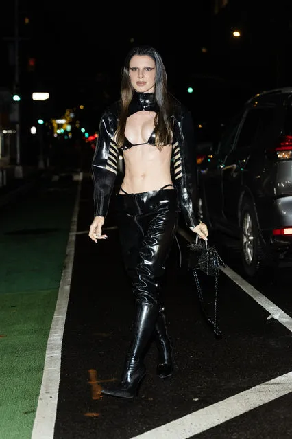 Julia Fox leaves little to the imagination as she steps out with friends in New York City on January 4, 2023. The American model and actress wore an ab baring top, black leather style pants, and matching boots. (Photo by The Image Direct)