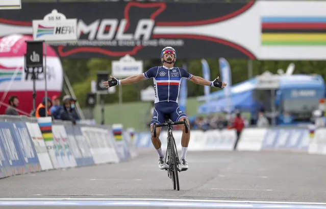 France's Julian Alaphilippe celebrates after winning the men's elite event, at the road cycling World Championships, in Imola, Italy, Sunday, September 27, 2020. (Photo by Andrew Medichini/AP Photo)
