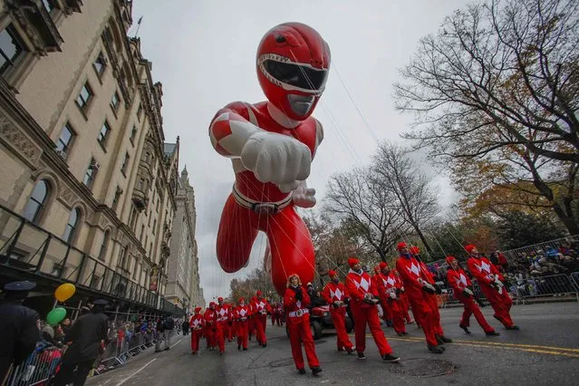 The red Mighty Morphin Power Ranger float moves down Central Park West during the 88th Macy's Thanksgiving Day Parade in New York November 27, 2014. (Photo by Eduardo Munoz/Reuters)