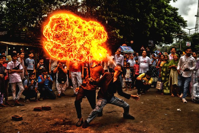 A stunt with fire during Ashura, the 10th day of Muharram in the Islamic calendar in Kolkata on July 6, 2025. Muharram is the first month of the Islamic calendar & Ashura is the tenth day of the month of Muharram, on which the commemoration of the martyrdom of Imam Hussain, the grandson of Prophet Muhammad (PBUH), during the battle of Karbala, is done. It is part of Mourning for Shia Muslims and a day of fasting for Sunni Muslims that is observed all over the World. (Photo by Avishek Das/SOPA Images/Rex Features/Shutterstock)
