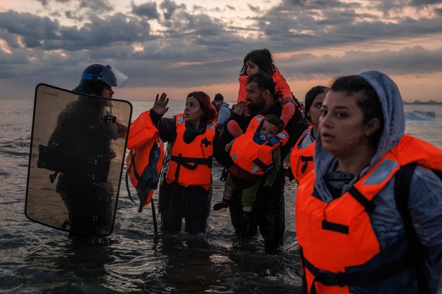 Police enter the water in Gravelines, France, to try to stop migrants from boarding small boats that had come to collect them on Friday, June 13, 2025. (Photo by Dan Kitwood/Getty Images)