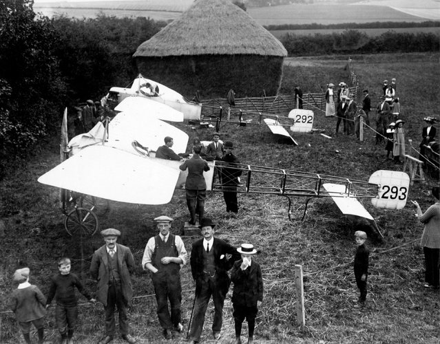 Curious onlookers watching as mechanics work on two Bleriot XI aircraft at Wantage, UK, 1913. (Photo by Air Historical Branch/RAF/PA Wire)