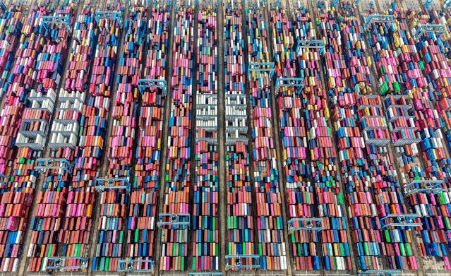 This photograph shows an aerial view of containers at a port in Qingdao, in eastern China's Shandong province, on September 24, 2025. (Photo by AFP Photo/China Stringer Network)