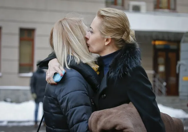 Yulia (R), wife of Russian opposition leader and anti-corruption blogger Alexei Navalny comforts Victoria, wife of Alexei's brother and co-defendant Oleg, after a court hearing in Moscow December 30, 2014. (Photo by Tatyana Makeyeva/Reuters)