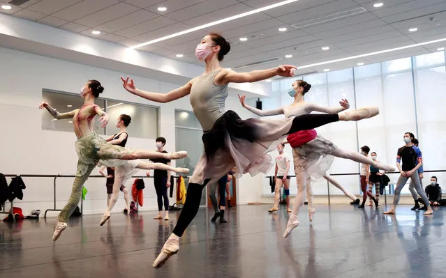 Dancers of The Shanghai Ballet take part in a training session at a dance studio amid the coronavirus outbreak on March 2, 2020 in Shanghai, China. The Shanghai Ballet is preparing for a scheduled tour in June this year. (Photo by Tang Yanjun/China News Service via Getty Images)