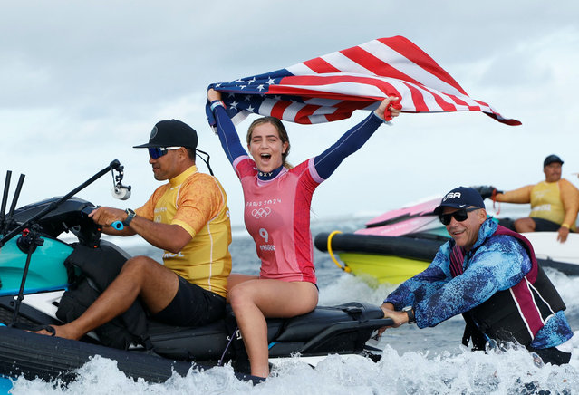 Caroline Marks (2nd L) of the United States celebrates after the women's gold medal match of surfing between Caroline Marks of the United States and Tatiana Weston-Webb of Brazil at the Paris 2024 Olympic Games in Teahupo'o, Tahiti, French Polynesia, on August 5, 2024. (Photo by Ben Thouard/Xinhua)