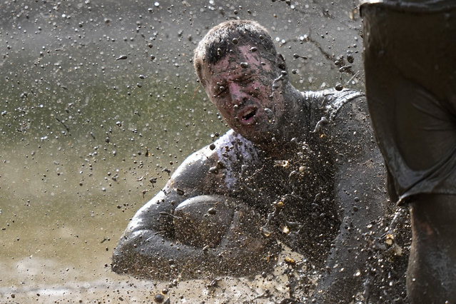 Mike Woodworth, of the the Muddas, goes down after making a catch in a game at the Mud Bowl in North Conway, N.H., Saturday, September 7, 3024. (Photo by Robert F. Bukaty/AP Photo)