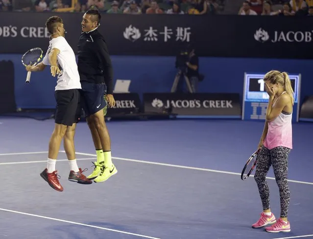 Canada's Eugenie Bouchard reacts as Australian players Nick Kyrgios and Thanasi Kokkinakis, left, celebrate a point win during the Kids Tennis Day event on Rod Laver Arena ahead of the Australian Open tennis championship in Melbourne, Australia, Saturday, January 17, 2015. (Photo by Mark Baker/AP Photo)