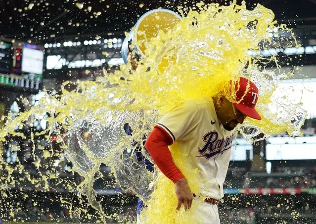 Marcus Semien #2 of the Texas Rangers is doused with sports drink after the game against the Seattle Mariners at Globe Life Field on June 03, 2023 in Arlington, Texas. (Photo by Sam Hodde/Getty Images)