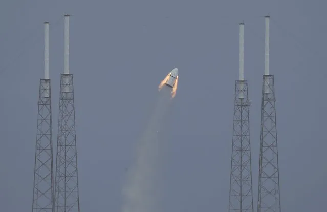 The unmanned SpaceX Crew Dragon lifts off from launch pad 40 during a Pad Abort Test at the Cape Canaveral Air Force Station in Cape Canaveral, Florida May 6, 2015. (Photo by Scott Audette/Reuters)
