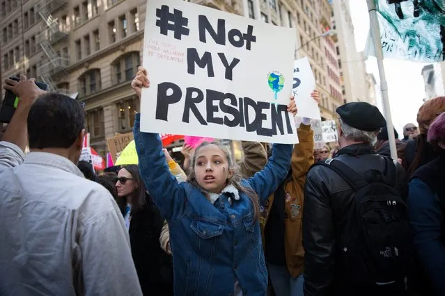 Thousands of protesters march up Fifth Avenue to Trump Tower to protest against President-elect Donald Trump, in Manhattan, New York, New York, USA, 12 November 2016. President-elect Donald Trump will become the 45th President of the United States of America to serve from 2017 through 2020. (Photo by Kevin Hagen/EPA)
