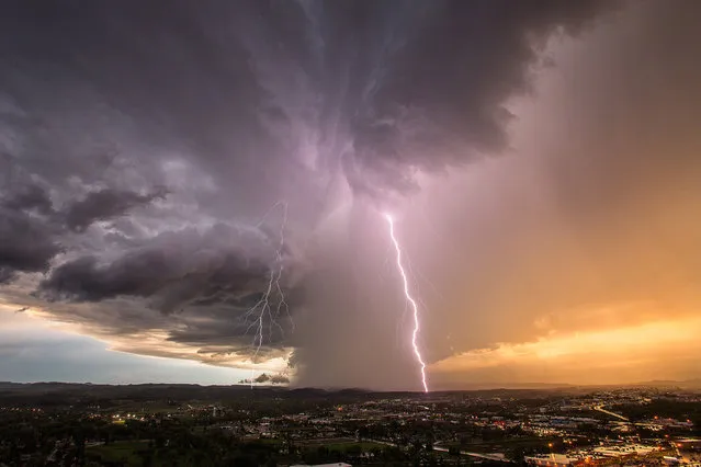 A decaying supercell hovers over the Rapid City, South Dakota area, dropping rain and lightning bolts. on June 1, 2015 in South Dakota, United States. (Photo by Mike Olbinski/Barcroft Media)