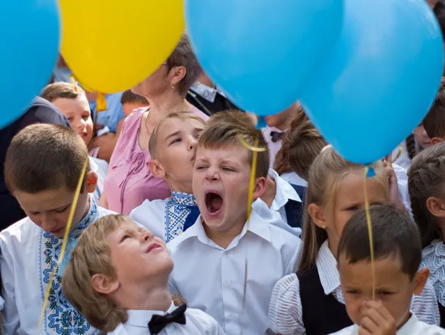 First graders attend a ceremony to mark the start of the school year in Kiev, Ukraine September 1, 2018. (Photo by Gleb Garanich/Reuters)